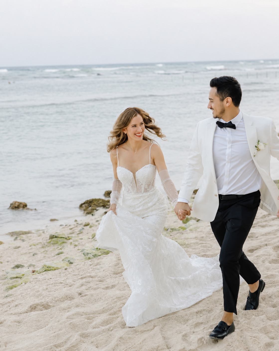 Elopement couple walking on the beach hand-in-hand, Riviera Maya